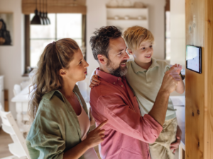 Family of three enjoying a functioning central heating and cooling system