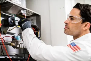 One Hour HVAC Tech Carlos working inside of a furnace unit in a Orlando FL home