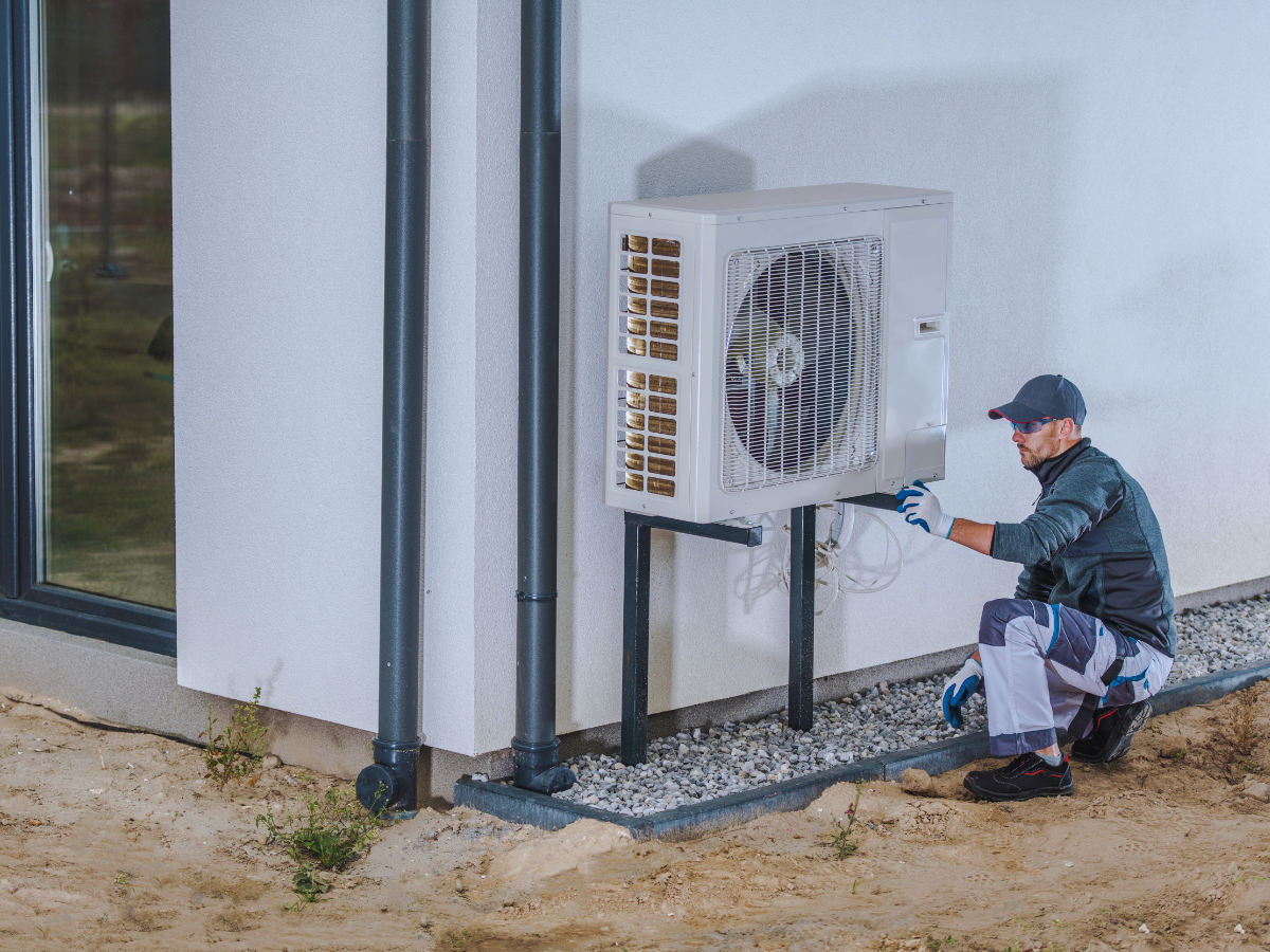 HVAC inspecting heat pump 