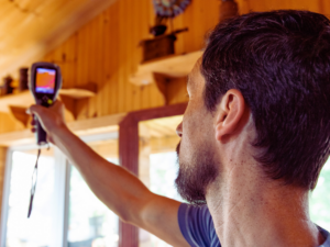 Man testing indoor air quality during Florida summer