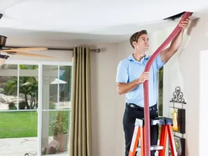One Hour Air Conditioning Tech performing a duct cleaning in an Orlando FL home